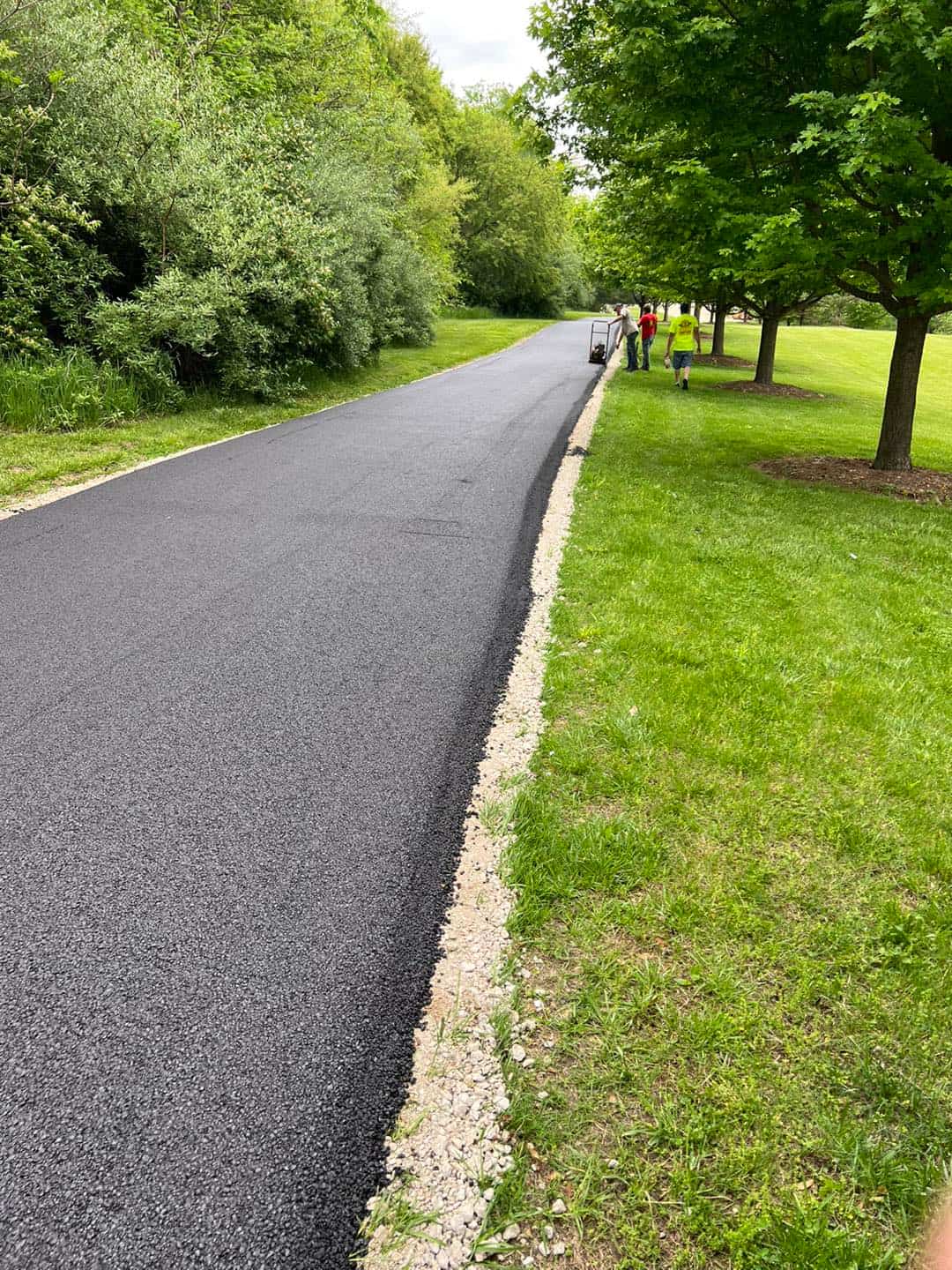 Clean concrete pathway with gravel edge in Arkansas