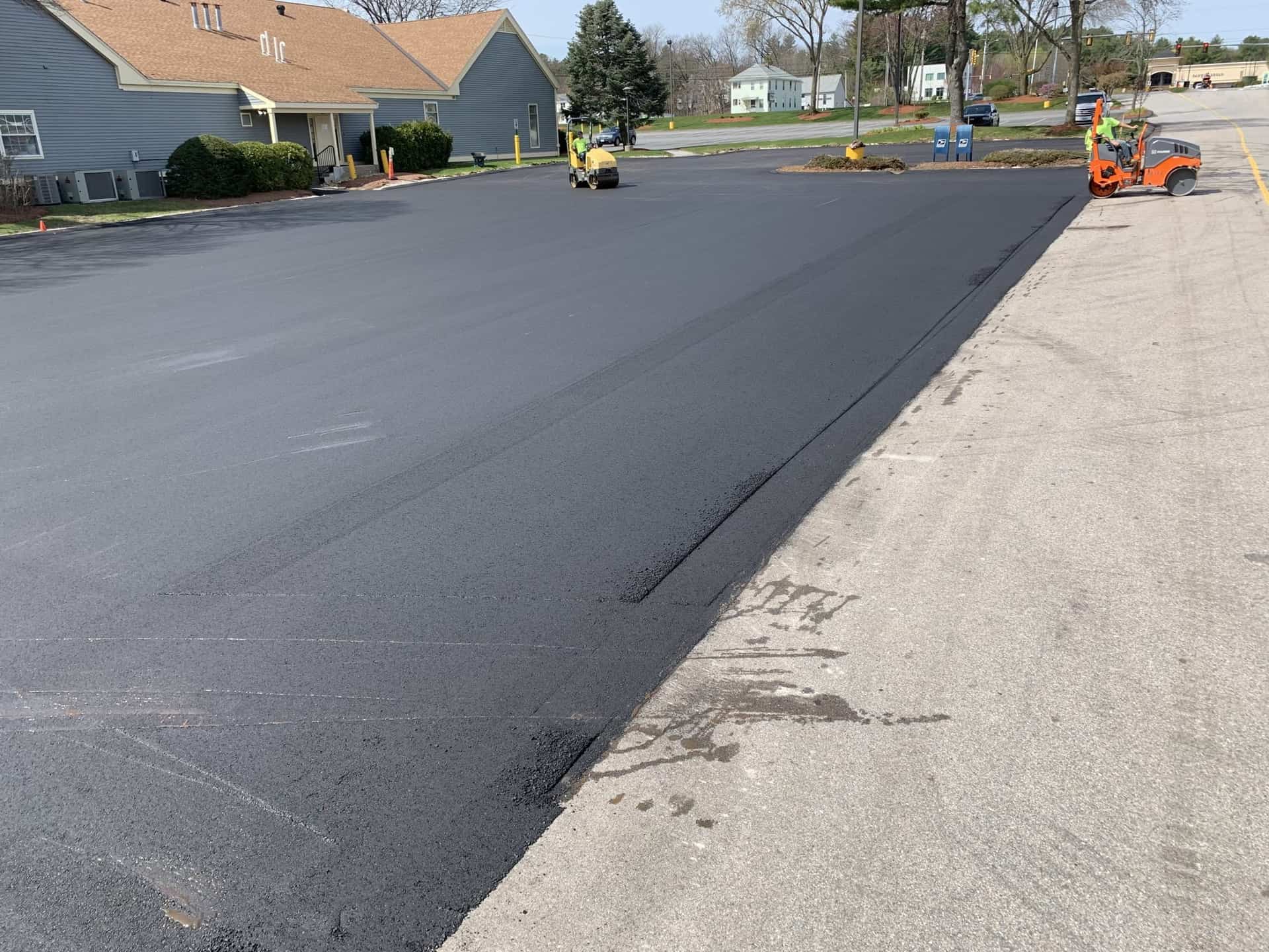 Asphalt repair crew fixing a parking lot